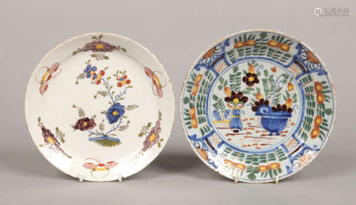 Two 18th century Continental polychrome delft plates. Each painted with flowers, largest 22.25cm