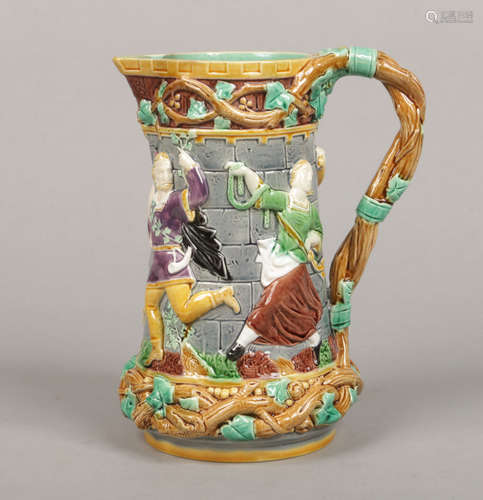 A Victorian Minton majolica Tower jug. Moulded with medieval figures, vines and decorated in