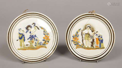 A pair of Swillington Bridge prattware pottery wall plaques of circular form. Moulded with Classical