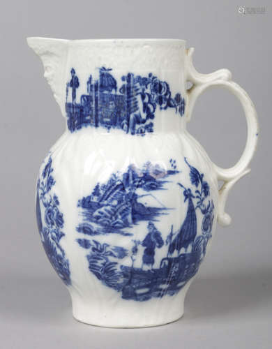 A Caughley blue and white mask jug moulded to the body with overlapping leaves. Printed in