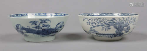 Two Liverpool blue and white slop bowls, one Richard Chaffers example painted with a bamboo fence on