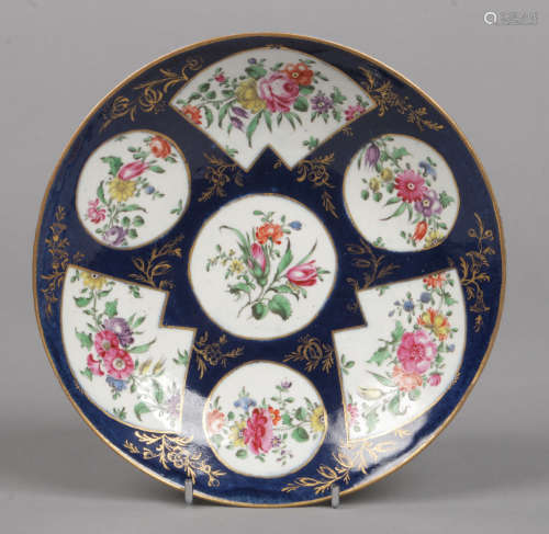 A Worcester saucer dish powder blue ground and with gilt floral. Having circular and fan shaped