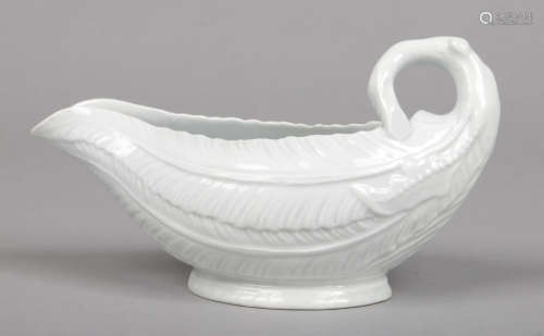 A rare Worcester white glazed sauceboat of cos lettuce leaf form raised over an oval foot c1758,