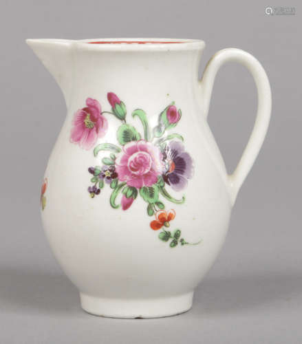 A Worcester sparrow beak jug with grooved loop handle. Painted in coloured enamels with a bouquet of