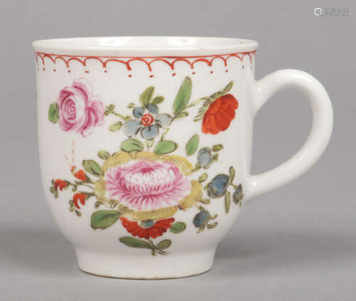 A Bow coffee cup with loop handle. Painted in coloured enamels with flowers under a loop and dot