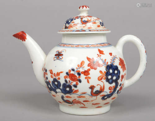 A Lowestoft teapot and cover of globular form. Painted in underglaze blue, iron red and gilt with