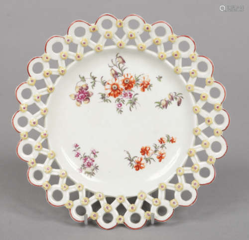 A Derby spectacle plate with typical pierced border moulded with flowers and edged in brown