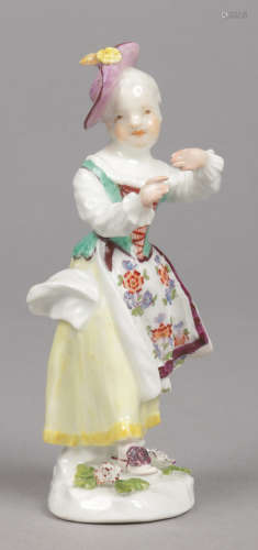 A small Meissen figure of a new dancer. Coloured in enamels and raised on a pad base ornamented with