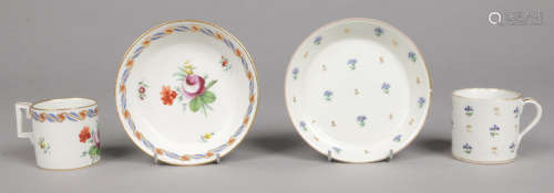 Two Vienna coffee cans and saucers. One 18th example painted in coloured enamels with flowers