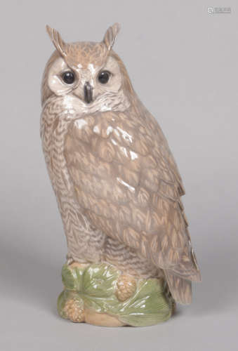 A large Royal Copenhagen model of a long eared owl by Peter Herold. Raised on a naturalistic base