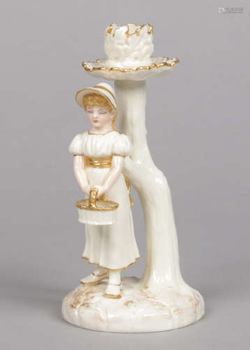 A fine Royal Worcester Hadley style figural candlestick. Modelled with a young girl holding a basket