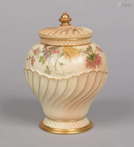 A Royal Worcester blush ground potpourri jar and cover of baluster form. Having wrythen moulded