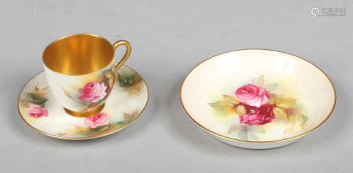 A Royal Worcester small coffee cup and saucer with gilt interior and painted with roses, signed M.