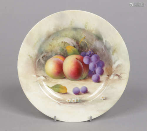 A Royal Worcester small plate by Albert Shuck. Painted with peaches and grapes. Signed but unmarked,