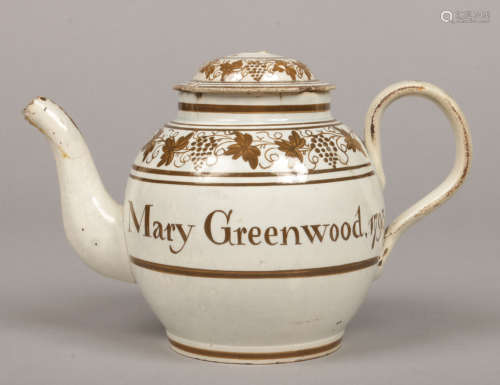 A pearlware globular teapot and cover. With monochrome decoration of trailing vines, festoons and