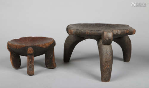 Two African tribal carved hardwood stools. Largest 40cm wide.