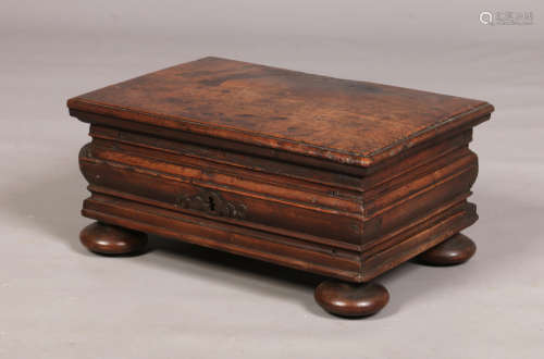An 18th century walnut bible box. With iron strap hinges, fitted interior, moulded sides and
