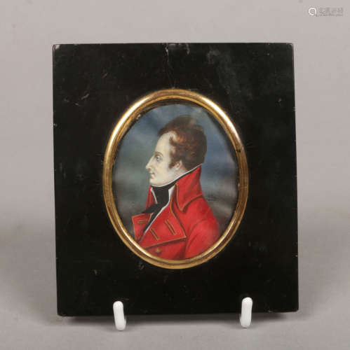 A Regency portrait miniature of a gentleman wearing a red overcoat and in ebonized frame. Signed