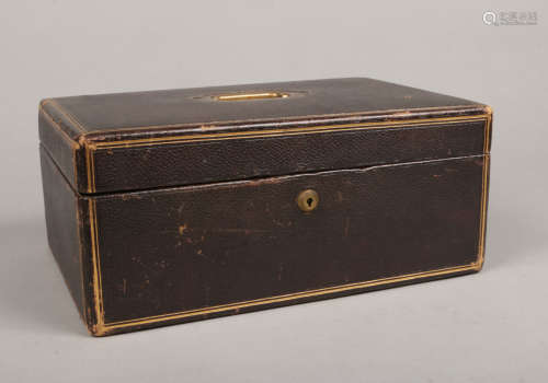 A Victorian leather mounted and fitted writing case with gilt embellishments and Bramah lock.