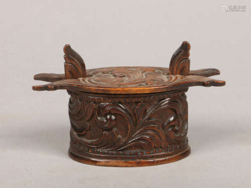 A Norwegian carved treen snuff box with leaf scrolls formed as a dry storage / butter box, 11cm.