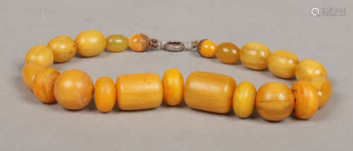 A sting of graduated butterscotch amber beads. Largest beads 24mm, gross weight 103 grams.