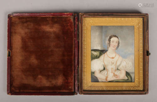 A Victorian ivory portrait miniature in leather mounted case and with gilt bronze frame. Portrait of