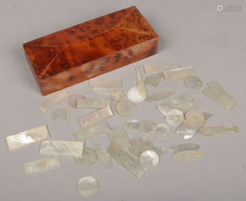 A collection of early 20th century Cantonese carved and incised mother of pearl gaming counters in