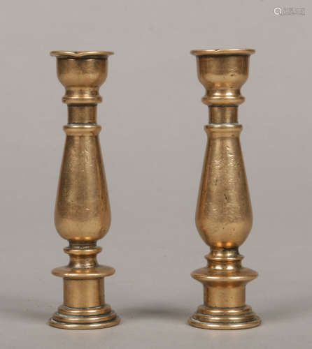 A pair of Georgian bronze taper sticks of baluster form, 9.5cm.Condition report intended as a