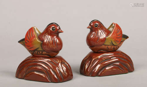 A pair of Art Deco lacquered bookends formed as mandarin ducks seated each on a mound base, 14cm.