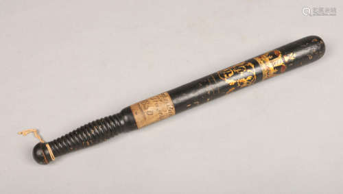 A Victorian turned and ebonized hardwood police truncheon. With gilt and painted crowned cipher V.