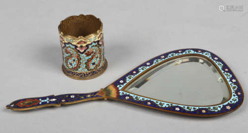 An early 20th century French bronze hand mirror with champleve enamel decoration along with a