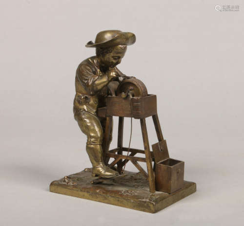An early 20th century French gilt bronze figural and mechanical vesta. Formed as a boy working a