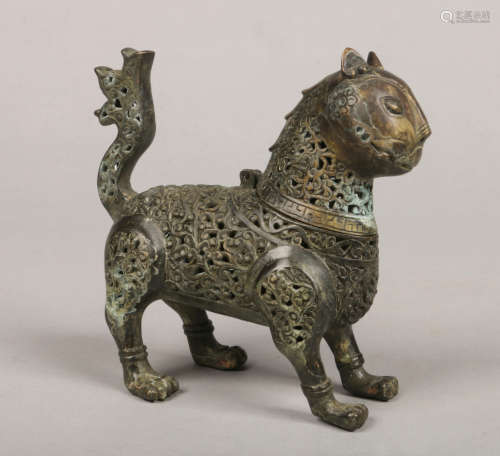 An Indo Persian verdigris bronze censor in the form of a stylized lion. Of pierced form and