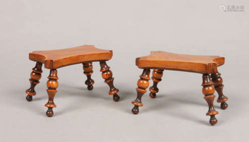 A pair of 19th century yew wood lace makers lamp stools. With shaped seats each raised on splay