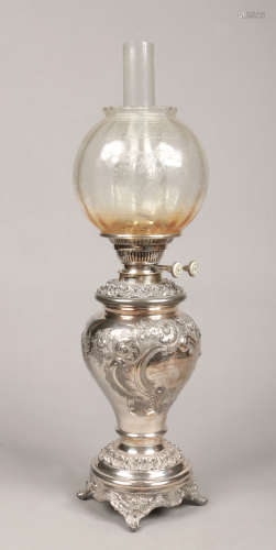 A Victorian silver plated presentation oil lamp by Walker & Hall, Sheffield. With frosted glass