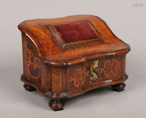 A 19th century Dutch marquetry table casket. With sloping top having rectangular velvet pad, with