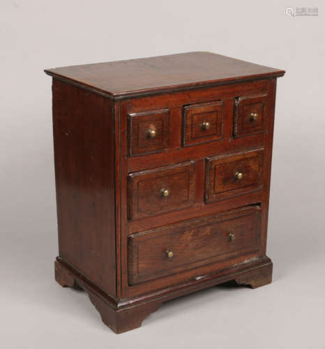 An early 19th century oak spice chest, with strung inlay and crossbanded in mahogany, 45.5cm high.