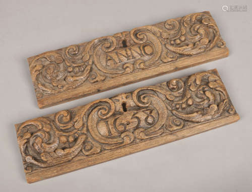 Two 17th century carved oak drawer fronts. With scrollwork cartouches framing inscriptions anno