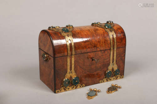 A 19th century French figured walnut dome top stationary box with fitted interior. Having gilt metal