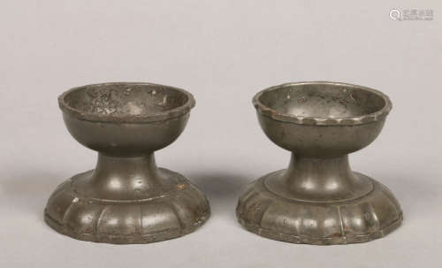 A pair of 18th century pewter salt sellers. Raised on scalloped spreading bases. Touch marks to