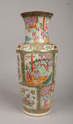A large 19th century Cantonese vase with gilt loop and mask moulded handles. With a typical gilt and