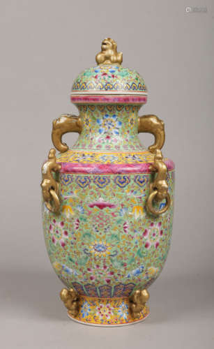 A Chinese lidded baluster vase. Turquoise ground and enamelled with lotus scrolls. With dog of fo