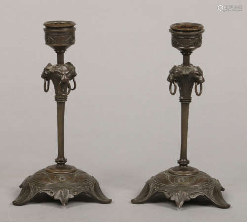 A pair of 19th century French bronze candlesticks of small proportions and with detachable
