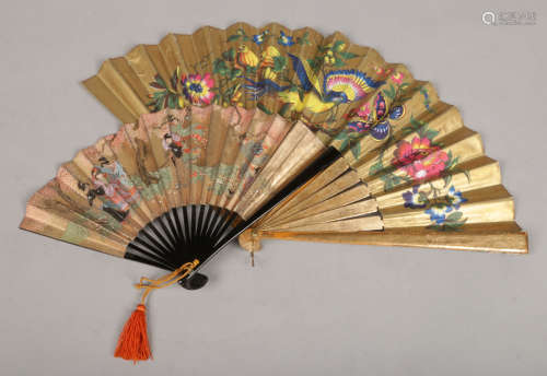 A Japanese Showa period small lacquered fan, painted on a gilt ground with bijin, signed. Along with