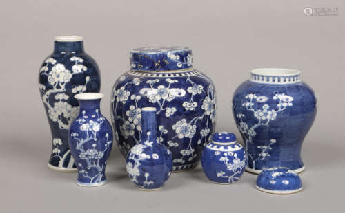 Three Chinese ginger jars and three vases decorated in underglaze blue with prunus blossom,