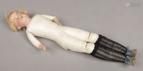 A 19th century Armand Marseilles doll with bisque head and arms supported on a jointed and leather