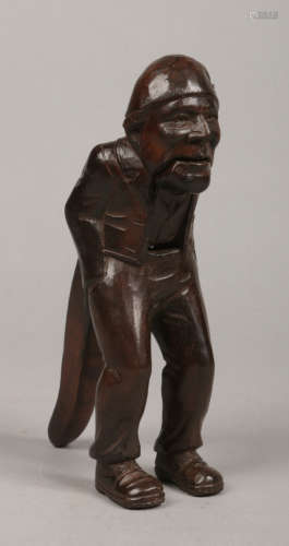 A 19th century carved Swiss nut cracker. Formed as a standing man wearing a nightcap and with his