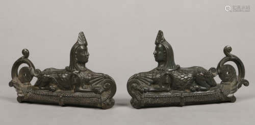 A pair of Victorian cast bronze furniture mounts formed as a pair of recumbent sphinx, 23cm long.