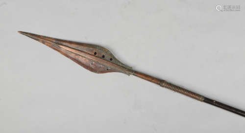 An African spear with copper mounts and pierced blade, 168cm.