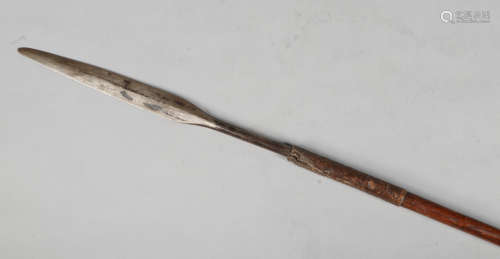 An African spear with woven vegetable strand and weighted, 171cm.